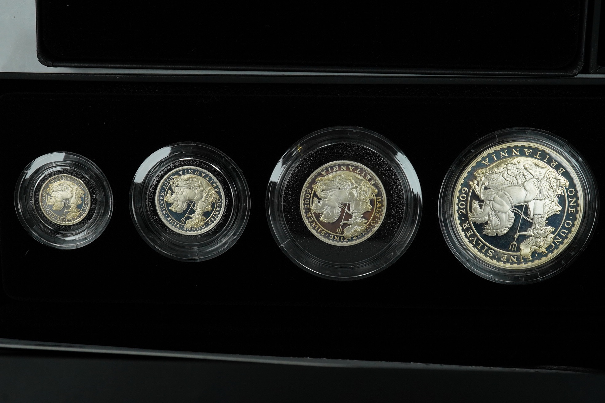 Royal Mint UK QEII proof coins, three Britannia four-coin silver proof sets, 2008, 2009 and 2011 and a Britannia collection three-coin silver proof set 2014, in 4 cases of issue with certificates